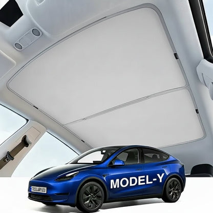 A blue Tesla Model Y car shown from the front three-quarter angle, positioned beneath an open white vehicle roof canopy. The side of the car has the text 'MODEL-Y' printed in white. TESLA_MODEL_Y_2022_2023_2024_2025_SUNSHADE_ROOF_BUY_FROM_IRELAND_AND_EUROPES_TESLA_ACCESSORIES_ONLINE_SHOP_TESLARY.EU