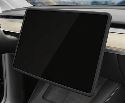 A black protective screen protector or cover applied to a large touchscreen display inside a car dashboard. TESLA_MODEL_Y_JUNIPER_TESLA_MODEL_3_HIGHLAND_16_SCREEN_YL_SCREEN_SILICONE_EDGE_PROTECTOR_BLACK_GREY_WHITE_BUY_FROM_IRELAND_AND_EUROPES_TESLARY.EU_TESLARY.FI_TESLARY.SE_TESLARY.ES_TESLARY.PT_TESLARY.CO.UK_TESLARY.IE