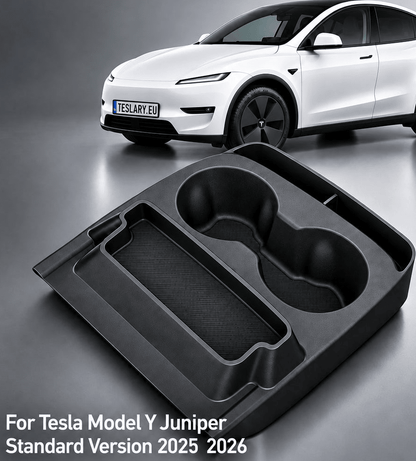 A black plastic car organizer tray with two cup holders and a long rectangular slot, shown in the foreground on a gray studio background. A white Tesla Model Y is blurred in the background, with text at the bottom reading 'For Tesla Model Y Juniper Standard Version 2025 2026'. tesla-model-y-juniper-standard-centre-console-cup-holder-with-storage-box-for-tesla-for-model-y-juniper-standard-version-only-organizer-accessories-interior-sto-5963228
