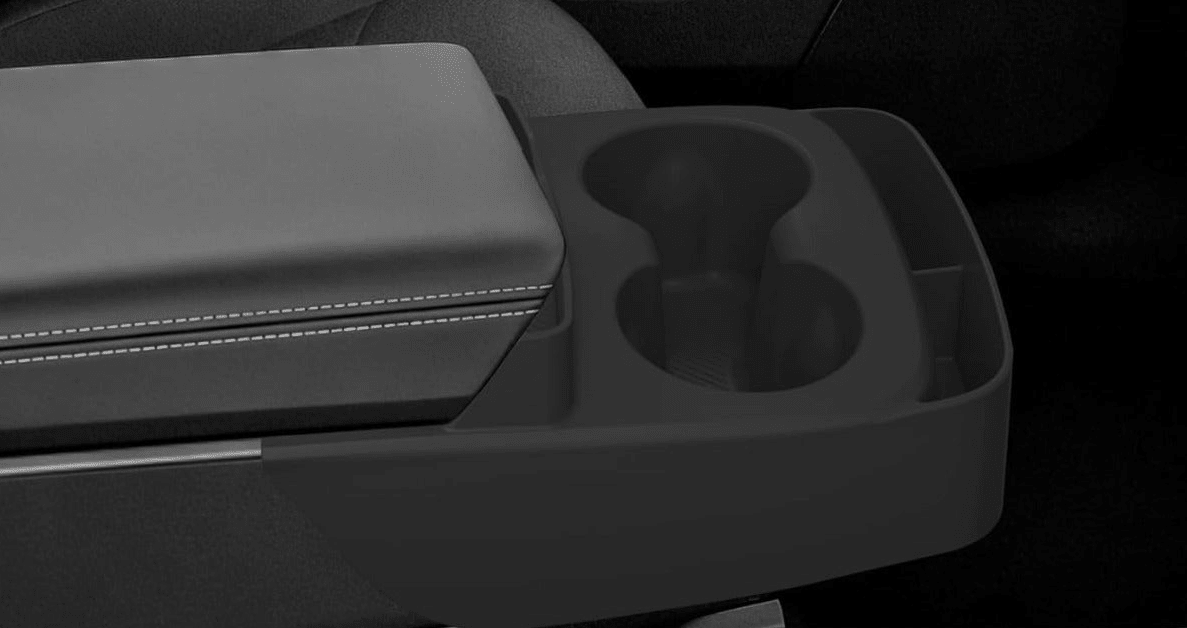 Close-up of a dark gray car center console armrest with a two-slot cup holder and a small storage compartment, shown in a dim interior setting. tesla-model-y-juniper-standard-centre-console-cup-holder-with-storage-box-for-tesla-for-model-y-juniper-standard-version-only-organizer-accessories-interior-sto-5963228