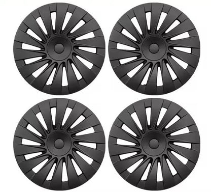 Four black multi-spoke hubcaps arranged in a 2x2 grid on a plain white background.