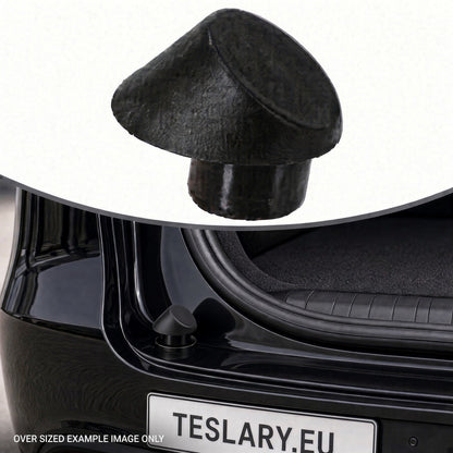 A black textured car trunk lid release cap shown floating above a black Tesla car trunk, with a small inset of the cap and a license plate reading TESLARY.EU. Tesla Trunk Rubber Stopper 1507940-00-C and 1507942-00-C Buy from Ireland and Europes teslary.eu