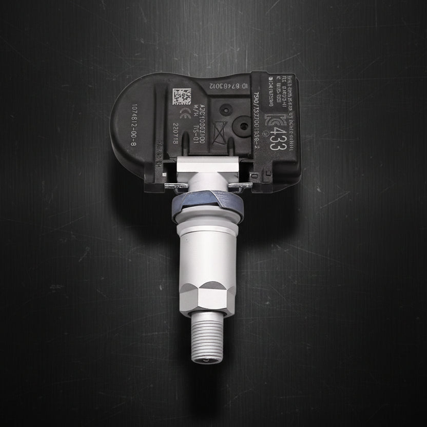 A tesla s x vehicle tire pressure sensor with a black plastic housing and a silver metal sensor body, shown against a plain white background.