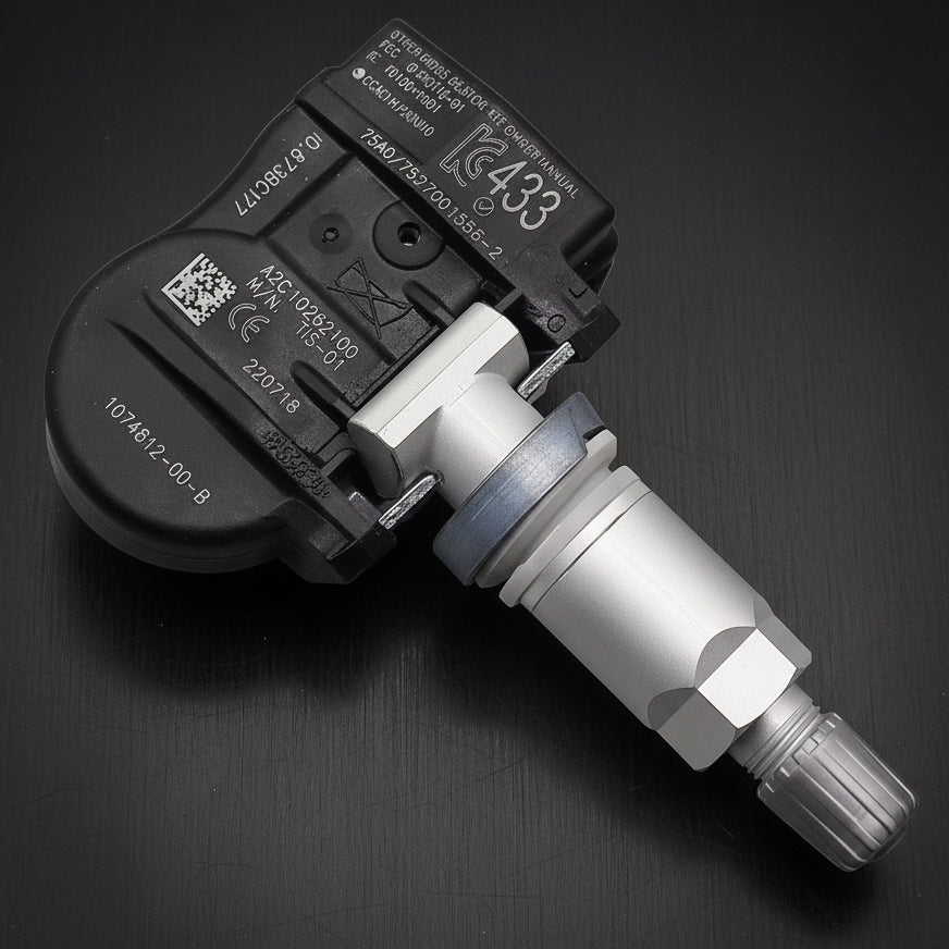 A automotive wheel speed sensor with a black plastic housing and a silver metal shaft, shown on a plain white background.