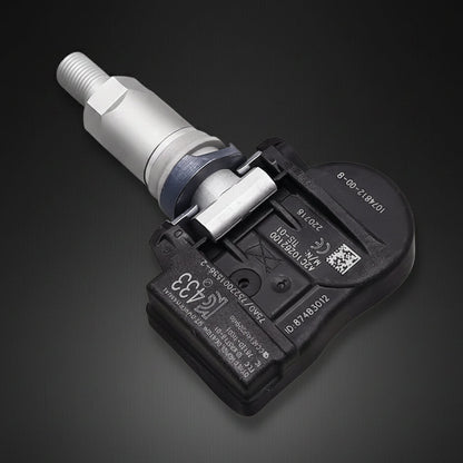 A automotive tire pressure sensor with a black plastic housing and a silver metal probe, shown on a plain white background.
